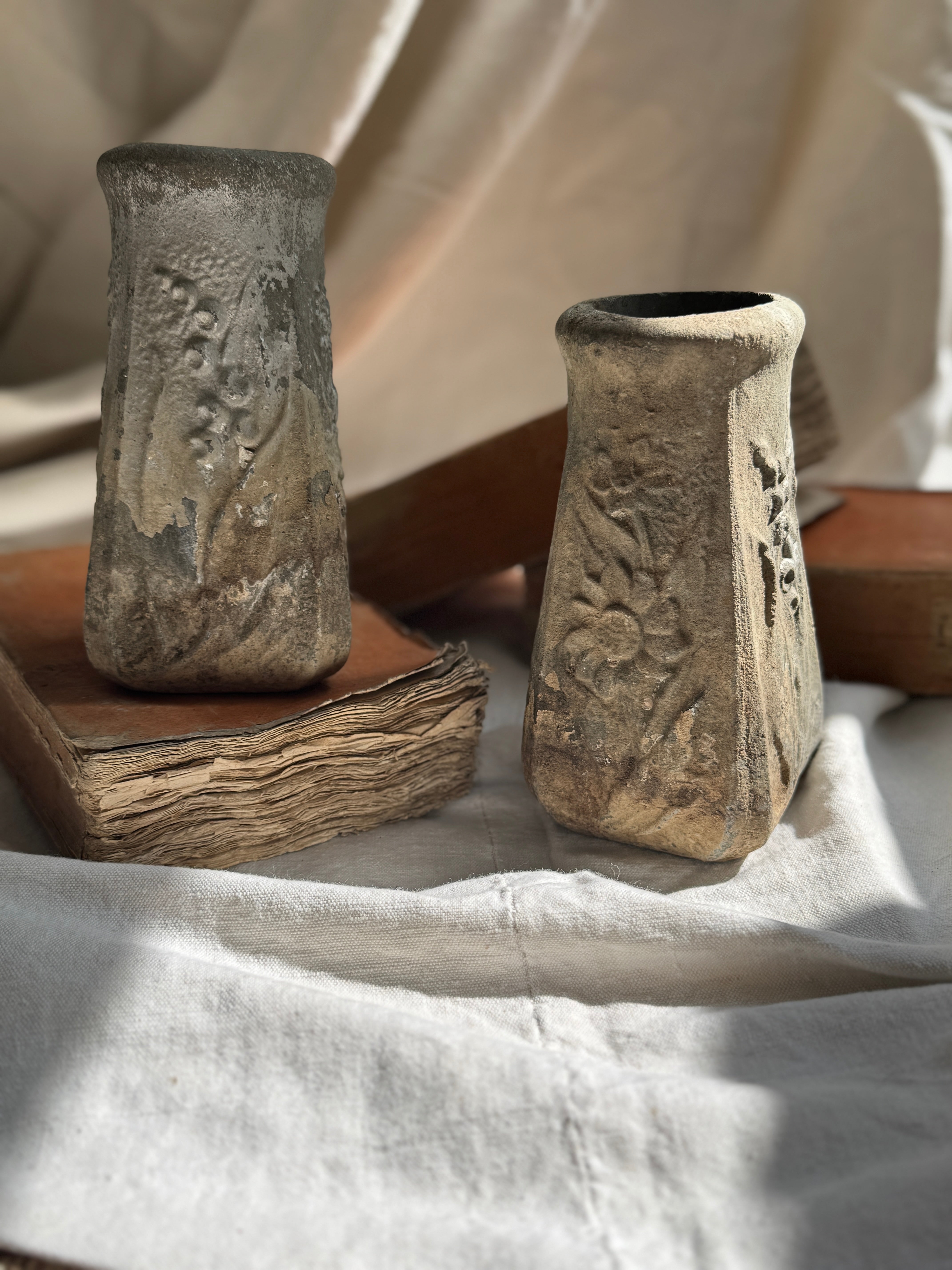 Weathered Cast Stone Vase with Floral Relief