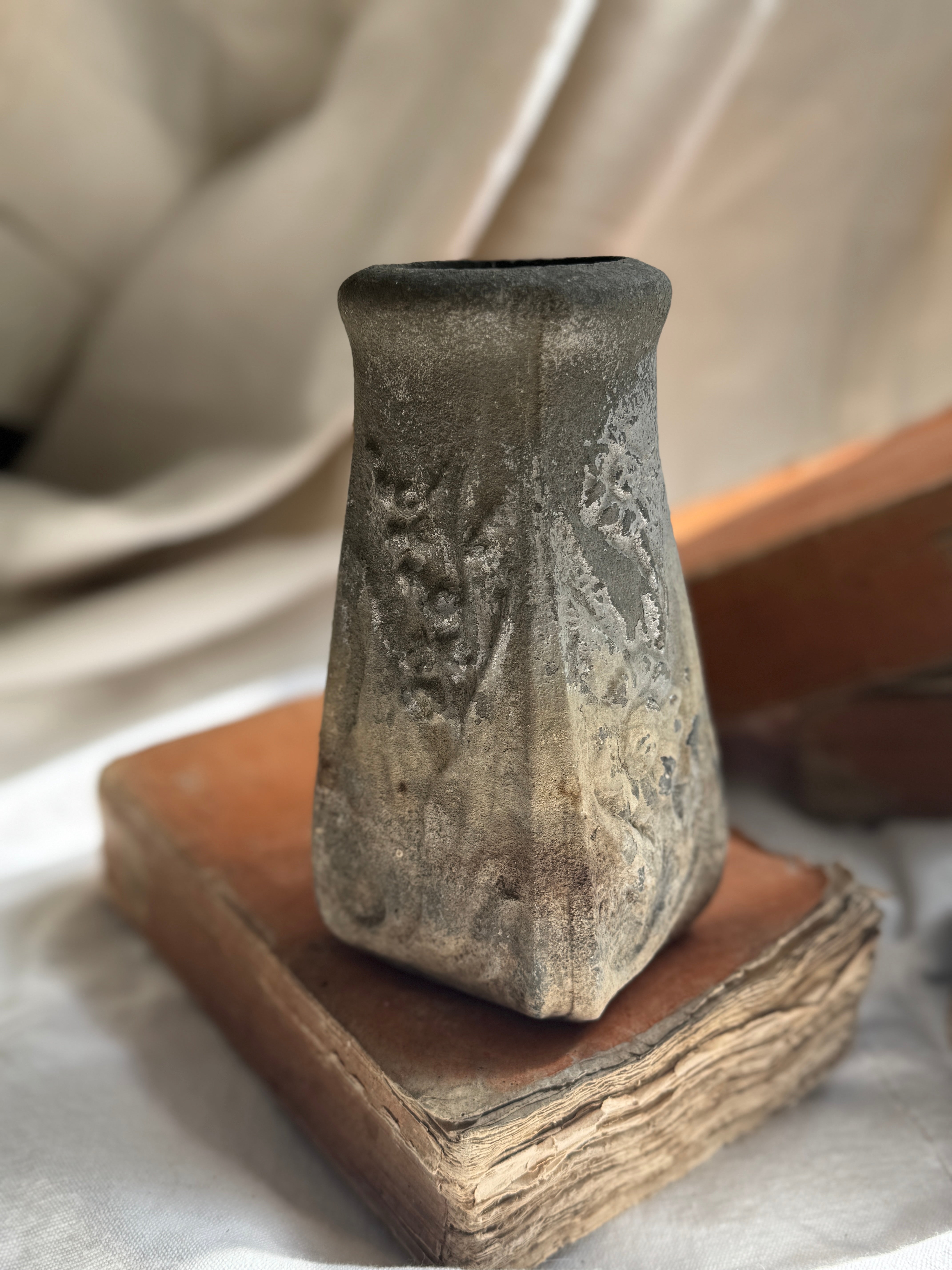 Weathered Cast Stone Vase with Floral Relief