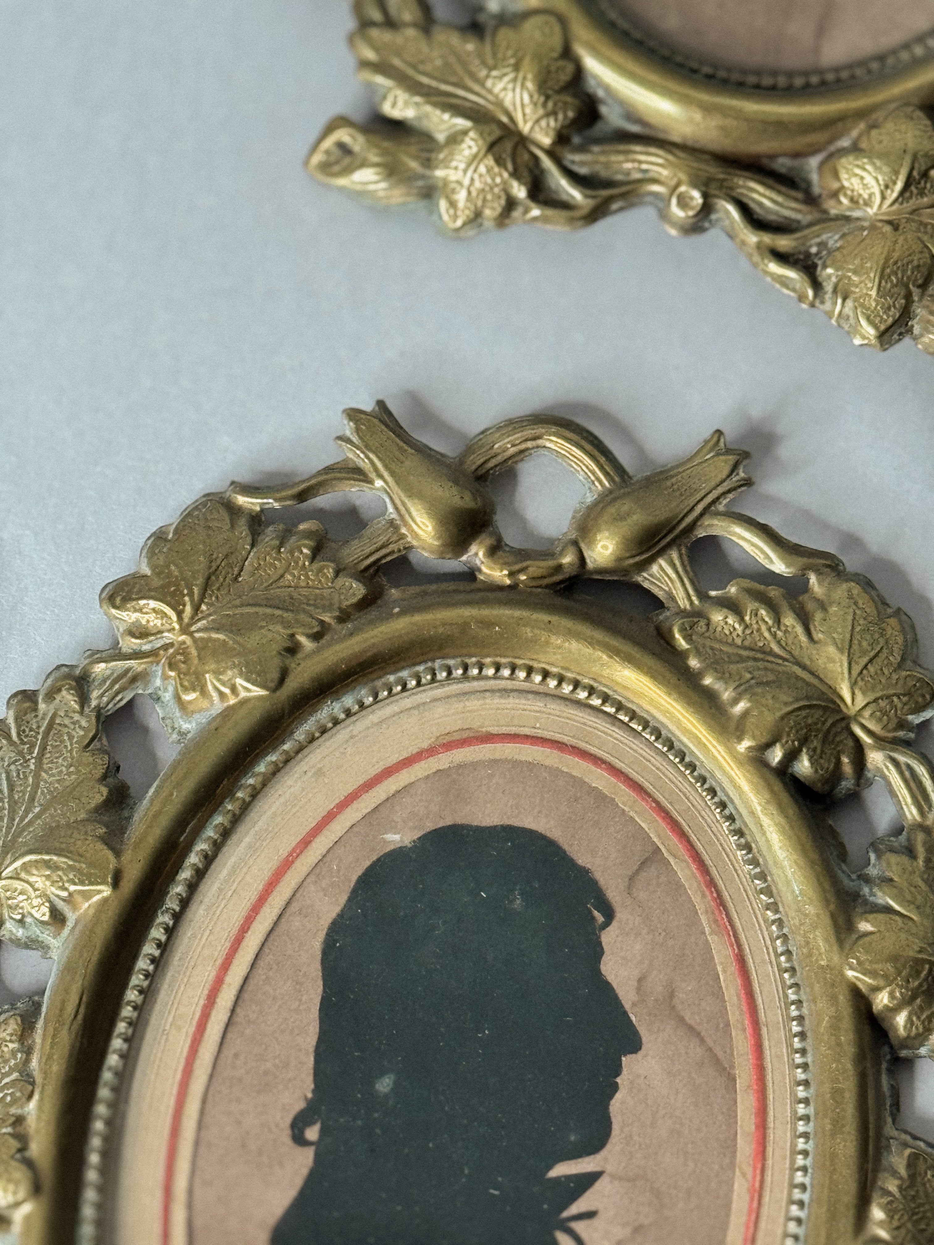 Pair of 19th-Century Silhouette Portraits in Romantic Brass Frames