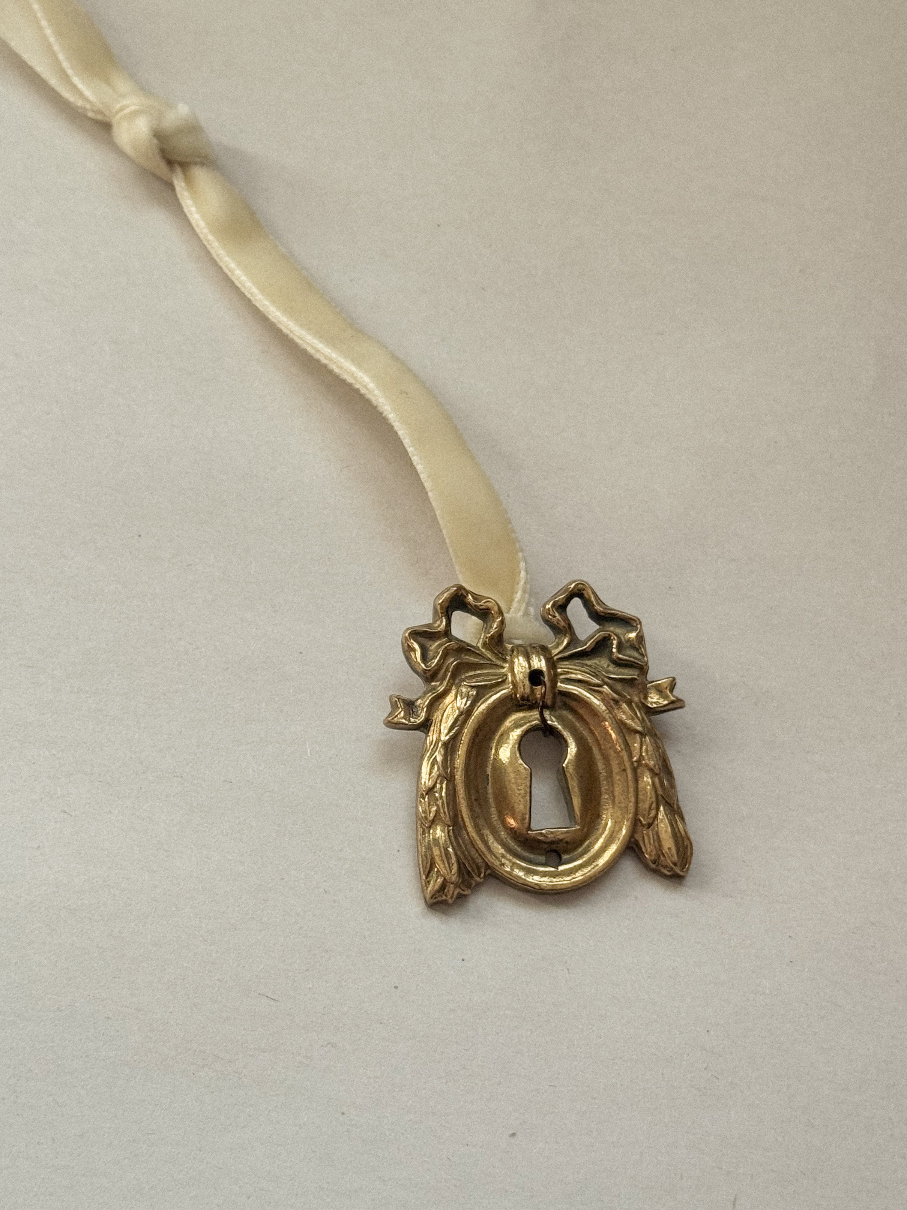 A: Antique French Escutcheon/Salvage Ornament on Antique Ribbon — Paris