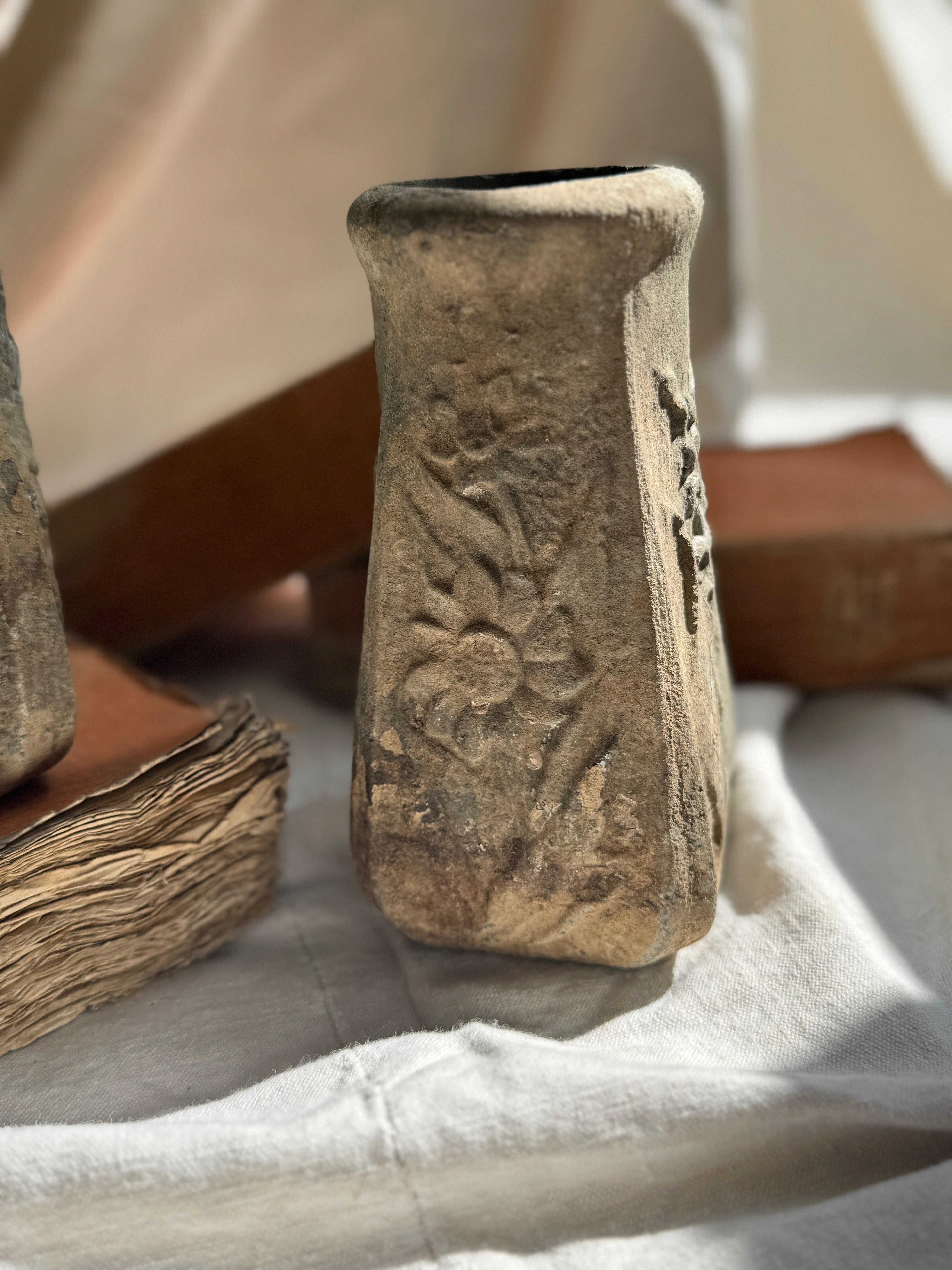 Weathered Cast Stone Vase with Floral Relief