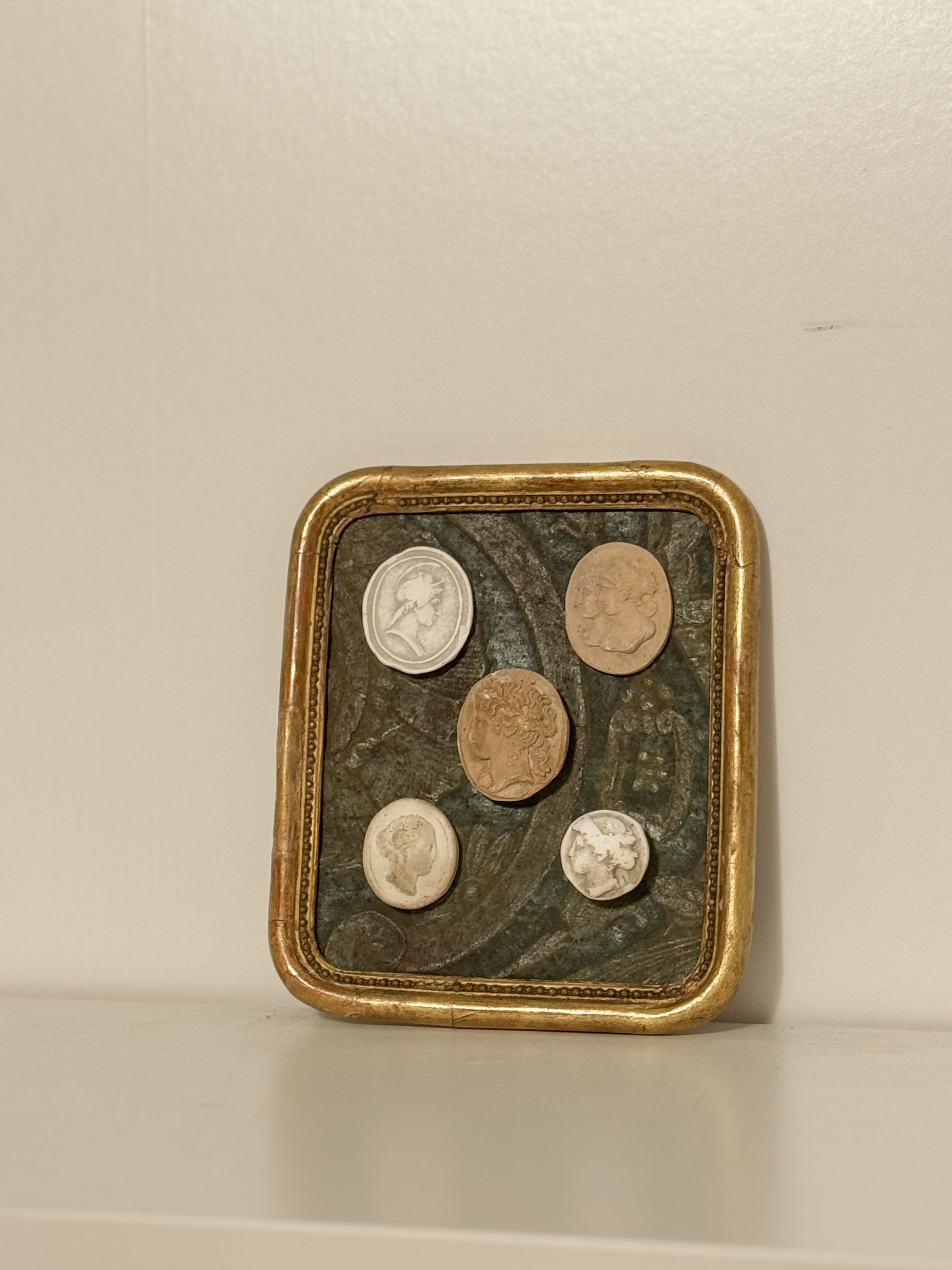 Antique tableau with plaster impressions