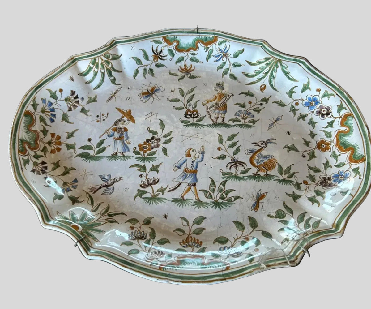 18th-century French Moustiers tin-glazed faience earthenware platter with polychrome grotesque decoration, hand-sourced in France